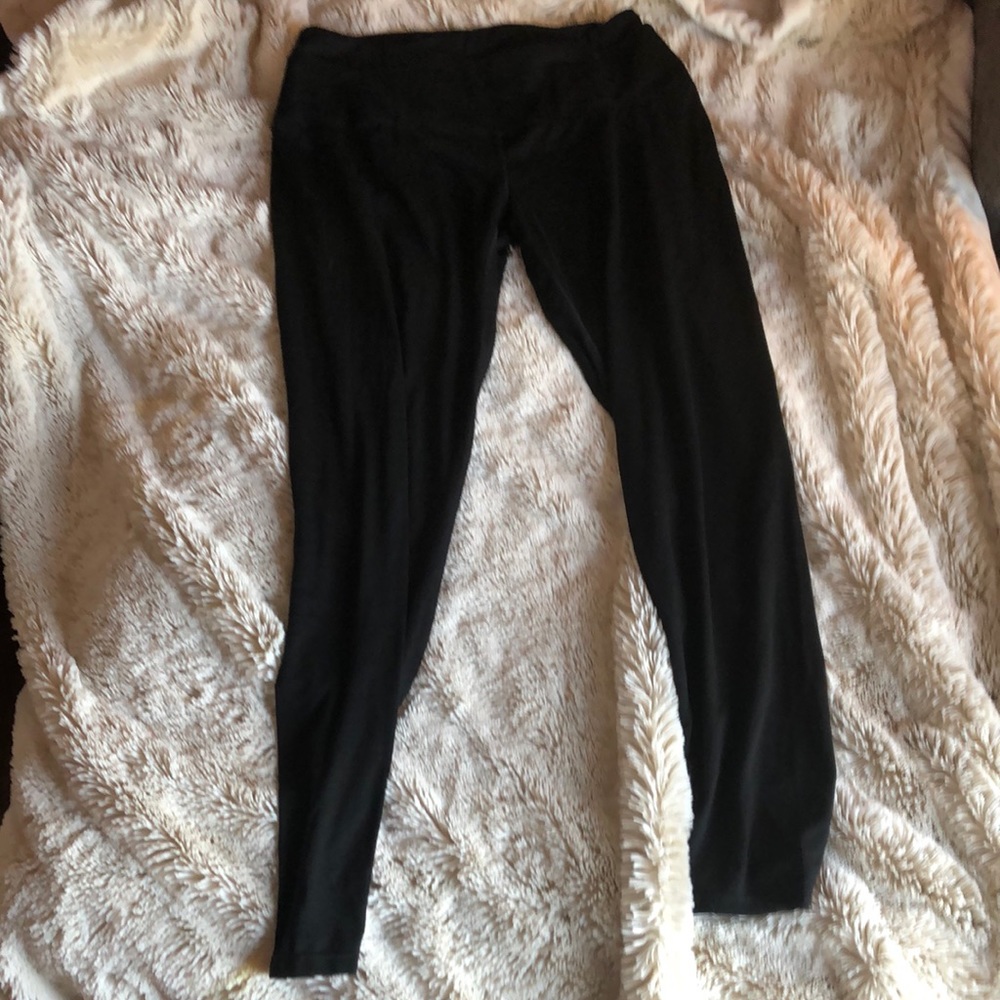 Black leggings, lightly worn. Has elastic band with outer band